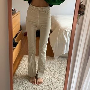Zara cream colour flare jeans. Slit on interior of each size of flare pant.